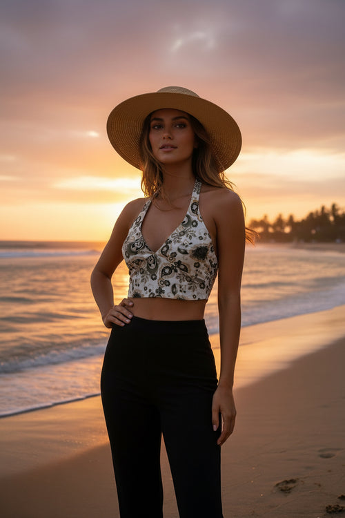 Patterned top on a mannequin against a plain wall.